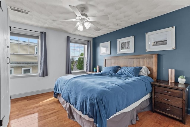12 School St Unit 3, Salem, MA 01970 - bedroom with wood finished floors, a ceiling fan, and baseboards