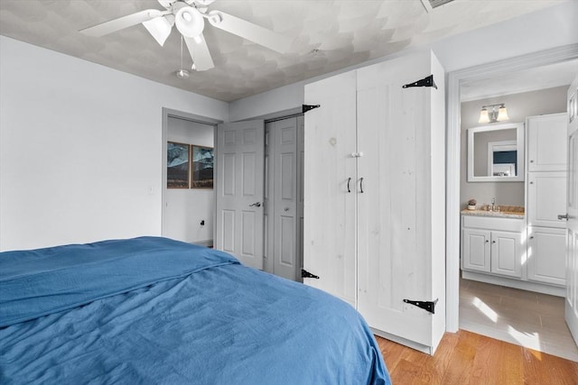 12 School St Unit 3, Salem, MA 01970 - bedroom with a sink, light wood finished floors, a ceiling fan, and ensuite bathroom