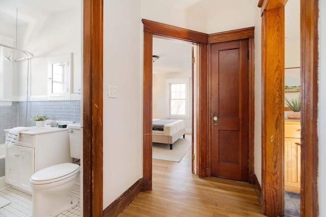 hall with light wood-type flooring