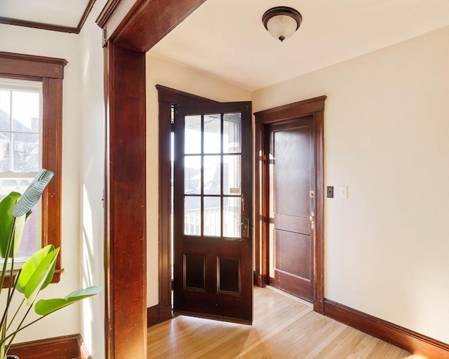 doorway with light wood-type flooring