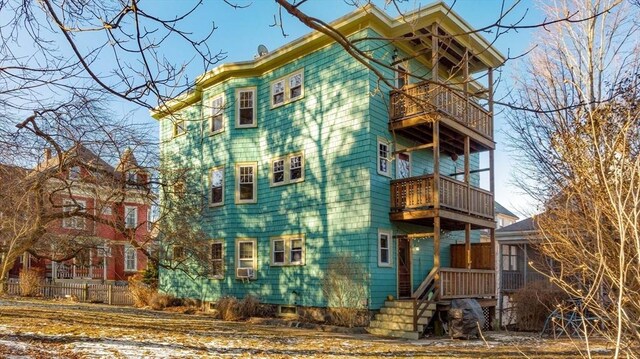 exterior space featuring cooling unit and a balcony