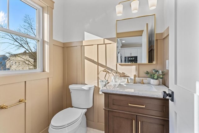 bathroom with vanity and toilet