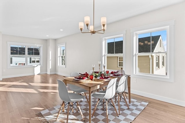 dining room featuring a chandelier and light hardwood / wood-style floors