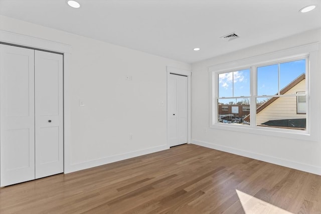 unfurnished bedroom featuring light wood-type flooring