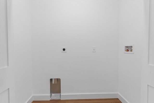 laundry area with hardwood / wood-style flooring, washer hookup, and hookup for an electric dryer