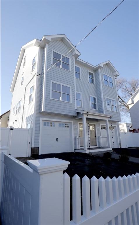 townhome / multi-family property featuring a garage