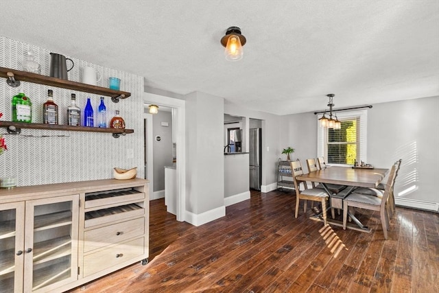 kitchen with stainless steel fridge with ice dispenser, dark hardwood / wood-style flooring, a textured ceiling, and an inviting chandelier