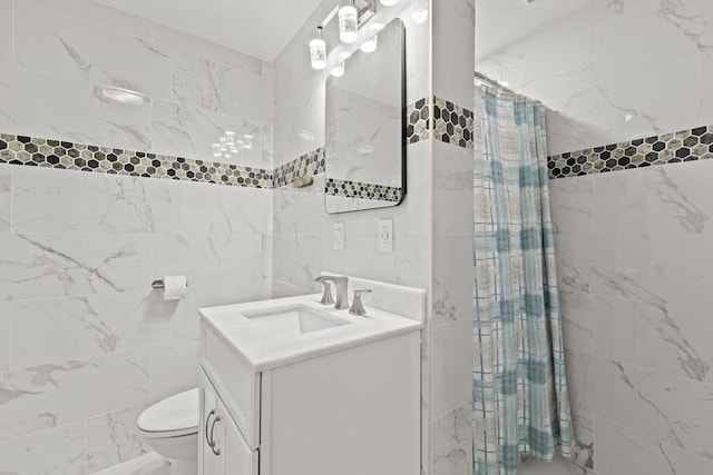 bathroom with toilet, vanity, tile walls, and walk in shower