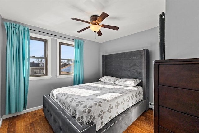 bedroom featuring ceiling fan and dark hardwood / wood-style floors