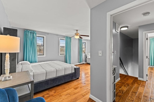 bedroom featuring ceiling fan and hardwood / wood-style flooring