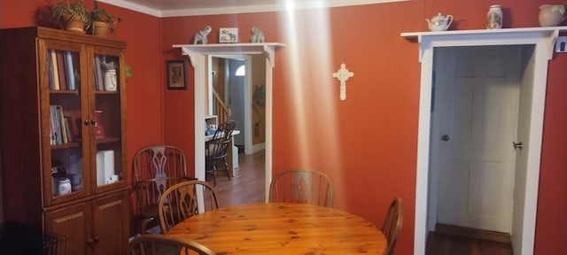 dining space with hardwood / wood-style flooring