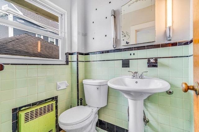 127-129 Blue Hills Pkwy, Milton, MA 02186 - bathroom with radiator, tile walls, and wainscoting