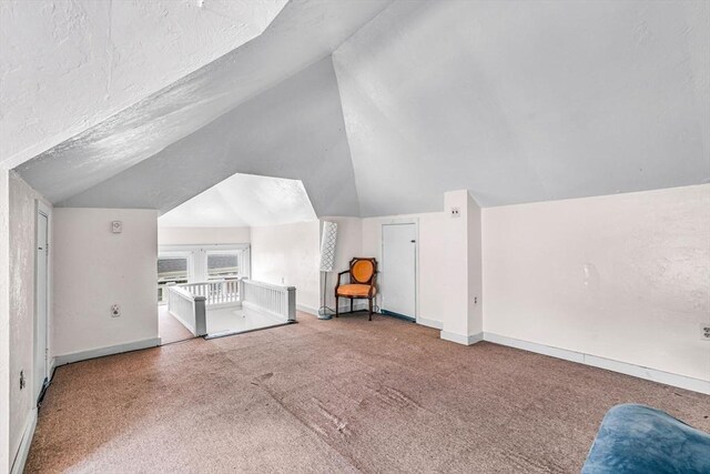 127-129 Blue Hills Pkwy, Milton, MA 02186 - additional living space with vaulted ceiling and carpet