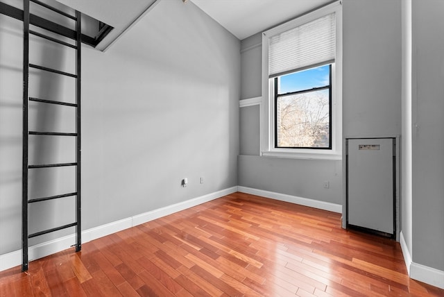 unfurnished room featuring wood-type flooring