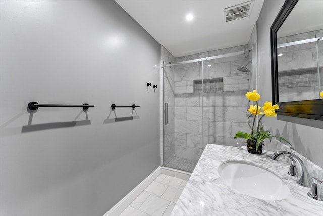 bathroom featuring vanity and an enclosed shower