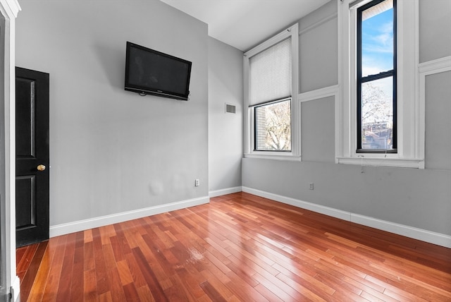 empty room featuring hardwood / wood-style flooring