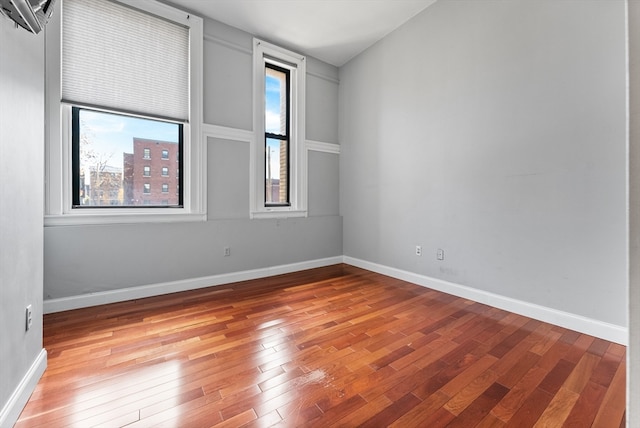 spare room with light hardwood / wood-style flooring