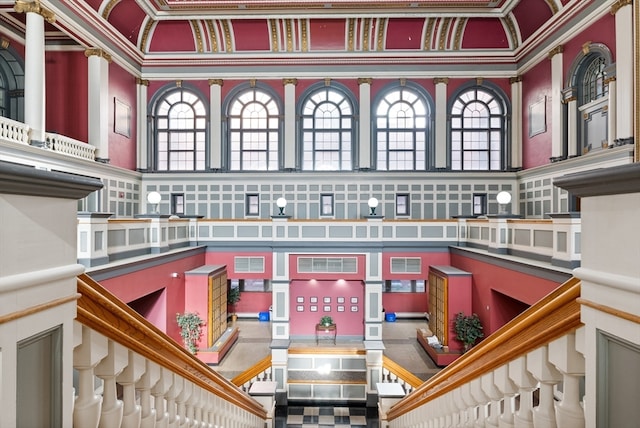 interior space featuring crown molding and a high ceiling