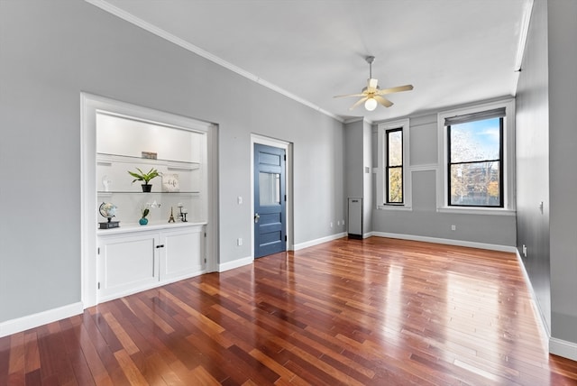 unfurnished room with hardwood / wood-style floors, ceiling fan, and ornamental molding