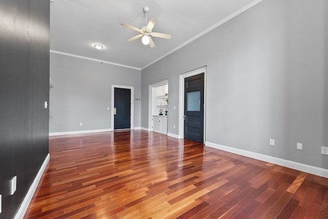 unfurnished room featuring ceiling fan, ornamental molding, and hardwood / wood-style flooring