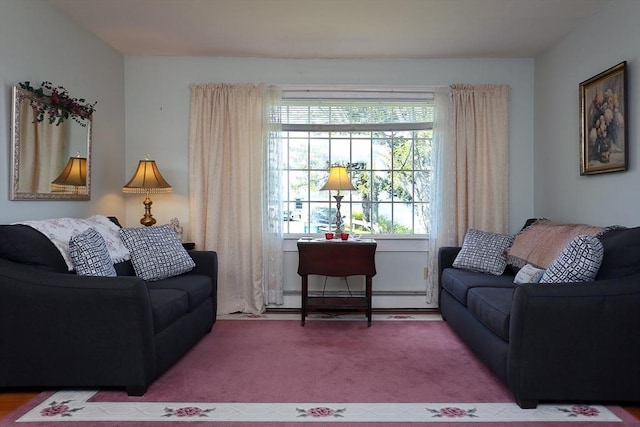 carpeted living area featuring a baseboard heating unit