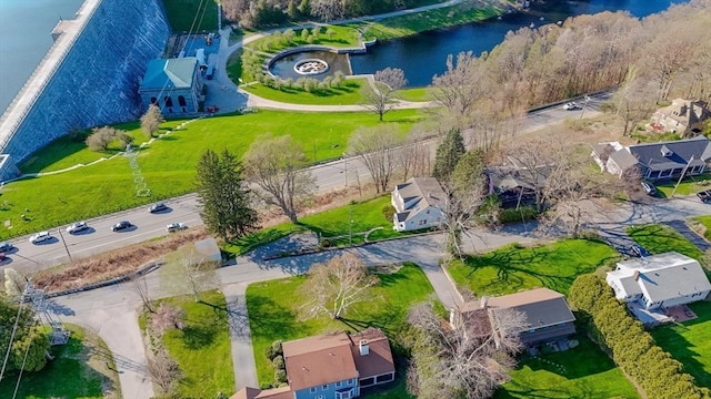 birds eye view of property featuring a water view and a residential view