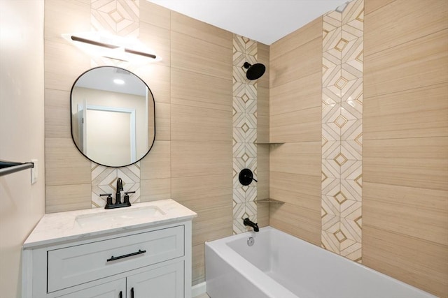 bathroom with shower / bath combination, tile walls, and vanity