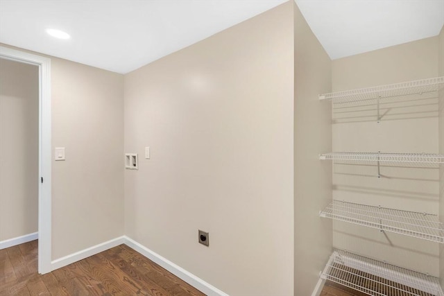 interior space featuring hookup for a washing machine, wood finished floors, baseboards, laundry area, and electric dryer hookup