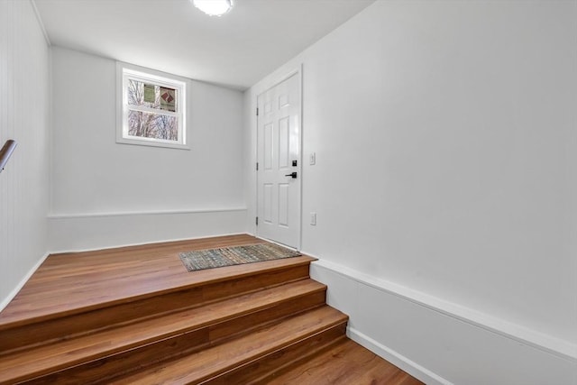 staircase with wood finished floors