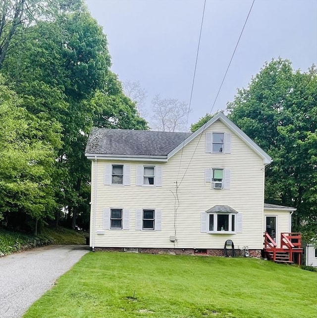 rear view of house with a lawn