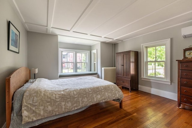 203 State St, Northampton, MA 01060 - bedroom with radiator heating unit, wood-type flooring, baseboards, and an AC wall unit