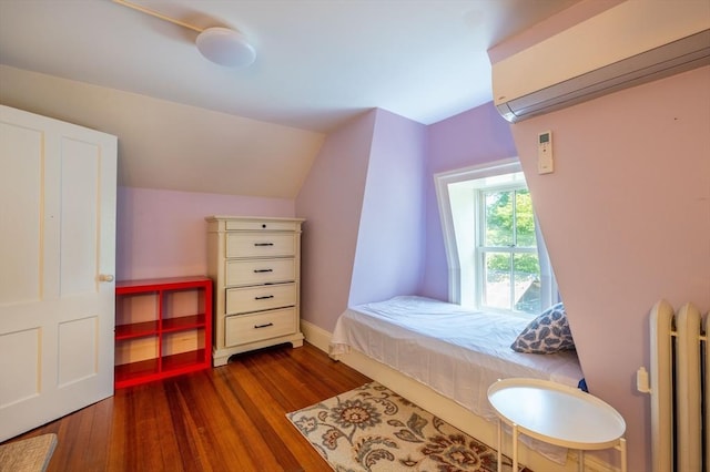 203 State St, Northampton, MA 01060 - bedroom with dark wood-type flooring, radiator heating unit, lofted ceiling, and baseboards