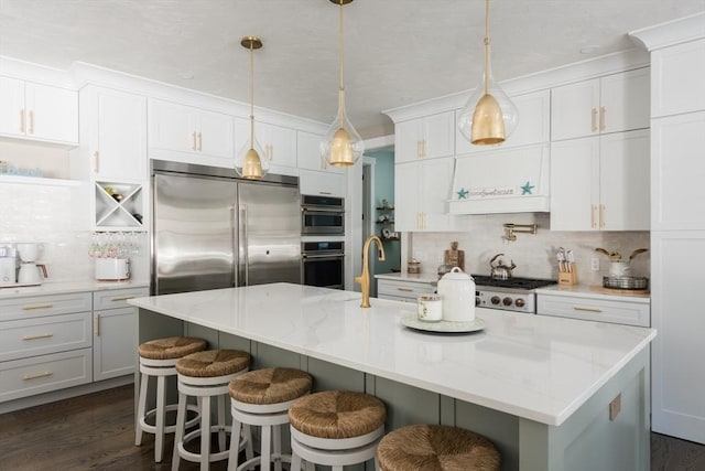 79 Neshobe Rd, Mashpee, MA 02649 - kitchen featuring stainless steel appliances, backsplash, white cabinets, and crown molding