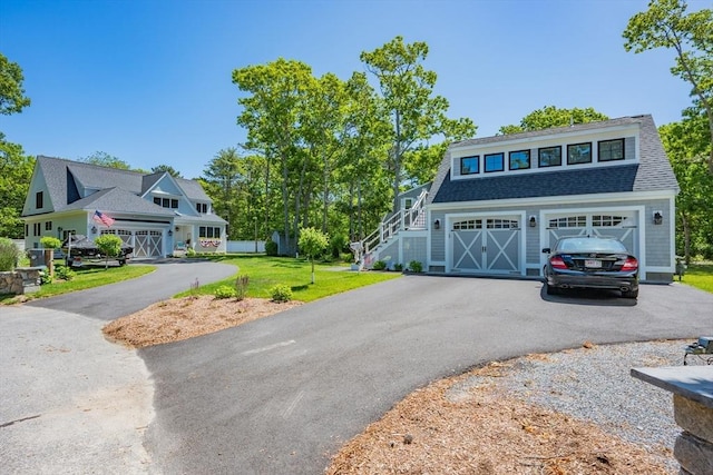79 Neshobe Rd, Mashpee, MA 02649 - shingle-style home with asphalt driveway, a front lawn, a garage, stairs, and a shingled roof