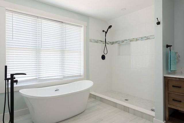 79 Neshobe Rd, Mashpee, MA 02649 - bathroom with a freestanding tub, a tile shower, and vanity