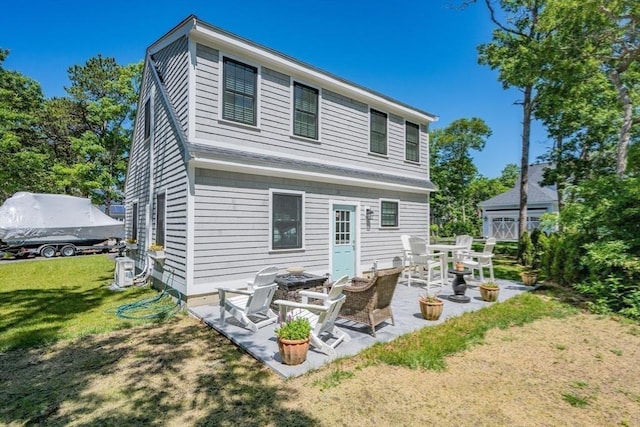 79 Neshobe Rd, Mashpee, MA 02649 - rear view of property featuring a yard and a patio area