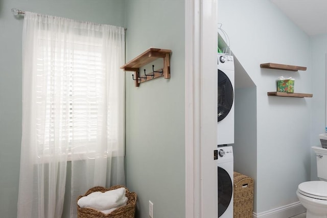 79 Neshobe Rd, Mashpee, MA 02649 - bathroom featuring stacked washing machine and dryer and toilet