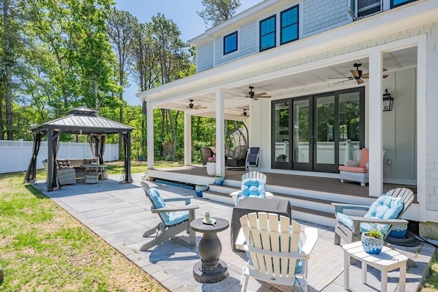 79 Neshobe Rd, Mashpee, MA 02649 - view of patio / terrace with an outdoor living space, a ceiling fan, a gazebo, and french doors