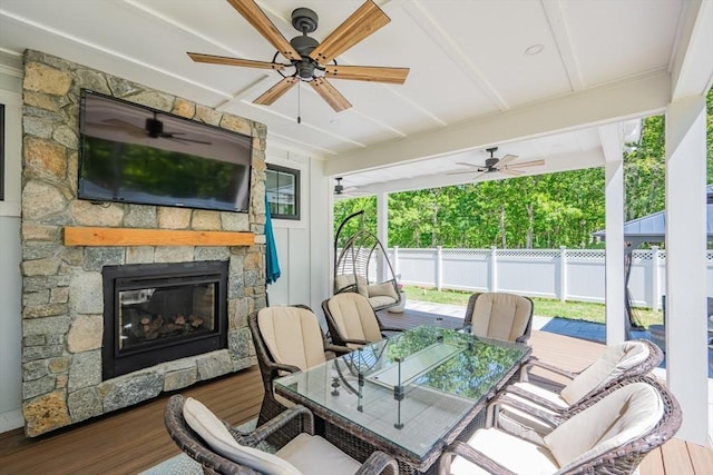 79 Neshobe Rd, Mashpee, MA 02649 - view of patio / terrace featuring a stone fireplace, ceiling fan, and outdoor dining area
