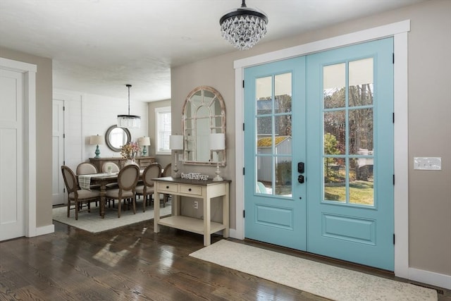 79 Neshobe Rd, Mashpee, MA 02649 - entryway with a chandelier and dark wood-type flooring