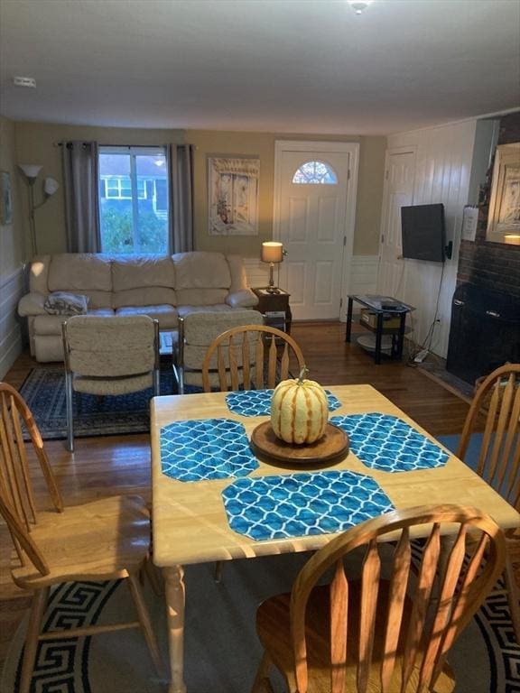 dining space with dark wood-type flooring