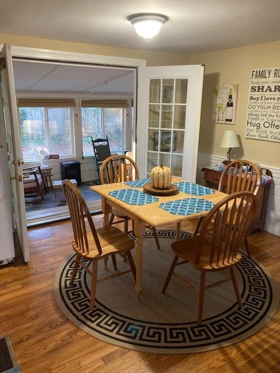 dining area with wood-type flooring