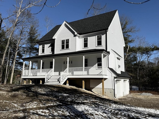 view of front of house with a garage and a porch