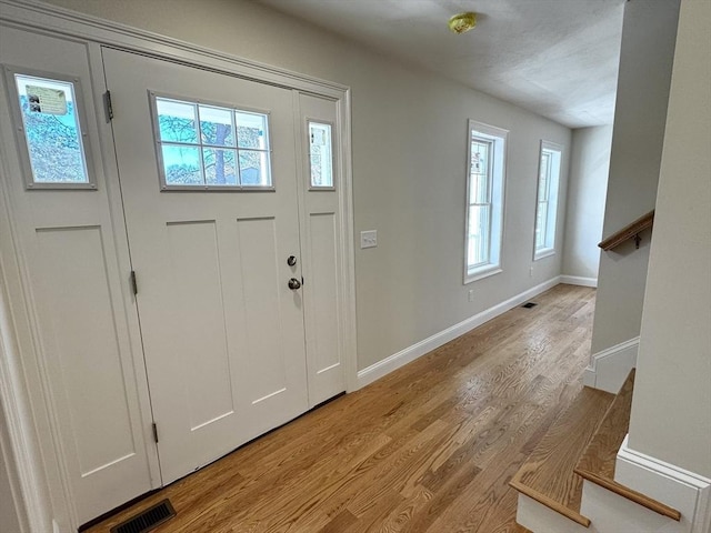 foyer with light hardwood / wood-style flooring