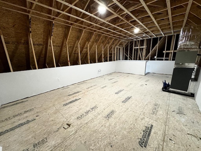 unfinished attic with heating unit