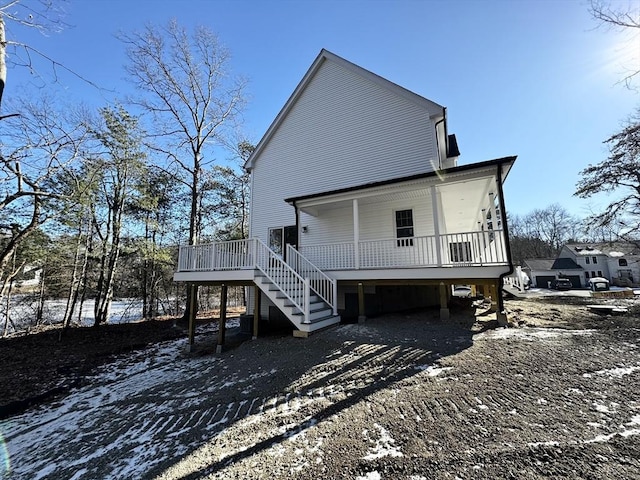 snow covered property featuring a porch