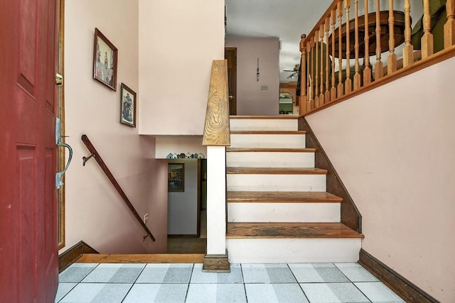 stairs featuring tile patterned floors