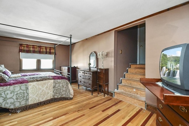 bedroom with hardwood / wood-style flooring