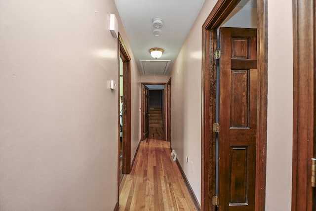 hall with light hardwood / wood-style flooring