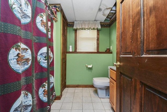 bathroom with tile patterned flooring and toilet